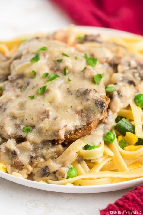 Juicy, tender Baked Cream of Mushroom Pork Chops. Enjoy these pork chops with flavorful mushroom gravy over rice, pasta, or mashed potatoes. Pork Chops Cream Of Mushroom, Soup Egg Noodles, Baked Pork Loin Chops, Cream Of Mushroom Pork Chops, Mushroom Soup Pork Chops, Pork Loin Chops Recipes, Baked Pork Loin, Baked Boneless Pork Chops, Boneless Pork Ribs