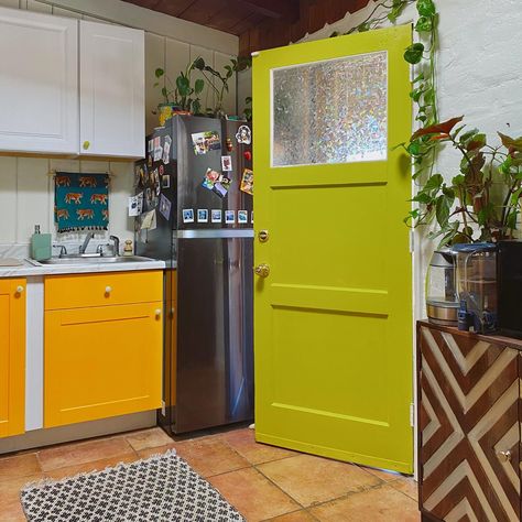 kitchen design with chartreuse green door and tangerine orange cabinets, mexican tile floors Orange And Green Kitchen, Budget Kitchen Makeover, Pop Art Decor, Orange Kitchen, Kitchen Design Color, Orange Interior, Funky Decor, Kitchen On A Budget, Green Kitchen