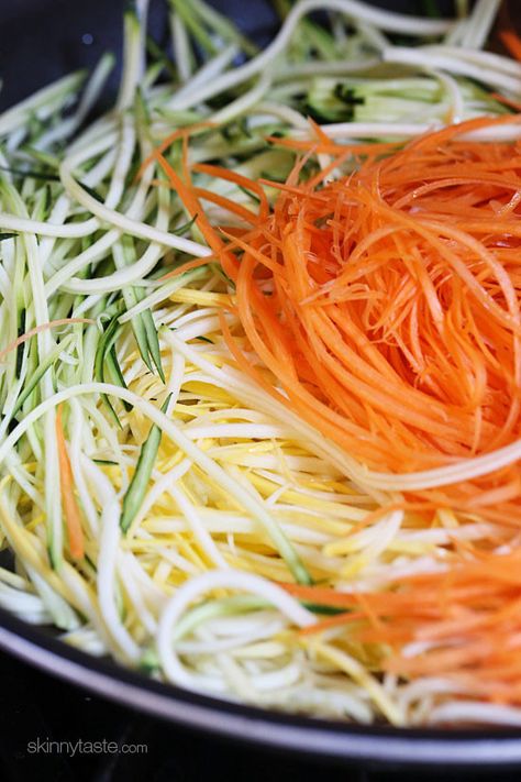 Zucchini, yellow squash and carrots cut into spaghetti like strands and sauteed with garlic and oil. I make this side dish ALL summer long – not just because it's low-carb, gluten-free, clean and paleo friendly, but because it's delicious, good for you and also happens to be my husband's favorite way to enjoy zucchini! Julienne Vegetables, Zucchini Yellow Squash, Garlic And Oil, Summer Vegetables, Spiralizer Recipes, Veggie Noodles, Skinny Taste Recipes, Yellow Squash, Summer Vegetable