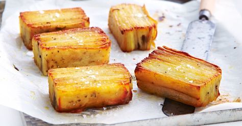 Thinly slice potatoes and layer with punchy rosemary for an elegant side. Potato Stack, Potato Pave, Yummy Potatoes, Potato Stacks, Airplane Food, Bean Recipe, Plate Presentation, Presidents Cup, Savoury Recipes