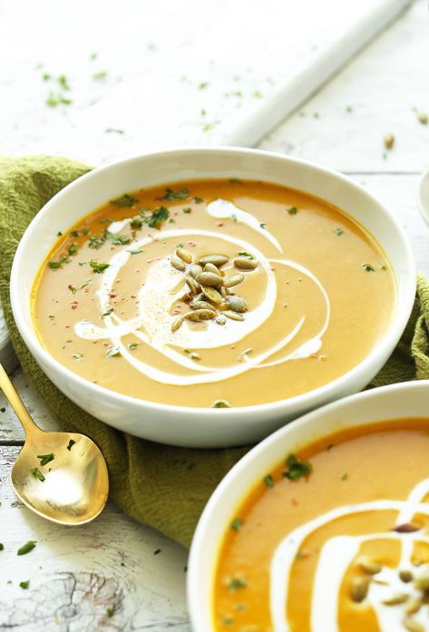 Close up shot of bowls of Curried Butternut Squash Soup with coconut milk and pumpkin seeds Curried Squash Soup, Best Butternut Squash Soup, Curried Butternut Squash, Butternut Squash Curry, Curried Butternut Squash Soup, Coconut Milk Soup, Butternut Squash Recipes Soup, Squash Soup Recipe, Roasted Butternut Squash Soup