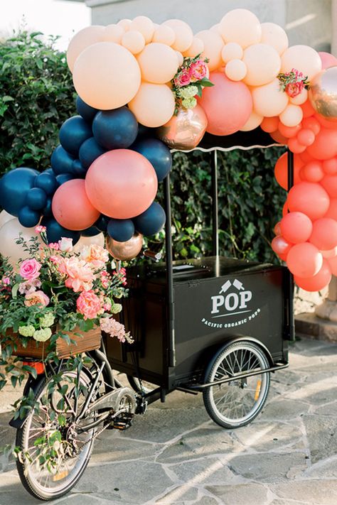 This vibrant popsicle stand has us dreaming of a #SummerWedding! ☀️ We’ll take one of everything. #CasablancaBridal | Photography: @three16photography | Popsicles: @pacificorganicpops | Balloons: @balloonzilla | Venue: @oldranchcountryclub | Planning & Design: @talaevents | Floral Design: @flowerallie Popsicle Cart, Colorful Balloon Arch, Ribbon Chandelier, Watercolor Table Numbers, Activation Ideas, Cart Ideas, Res Life, Ice Cream Cart, Balloon Arches