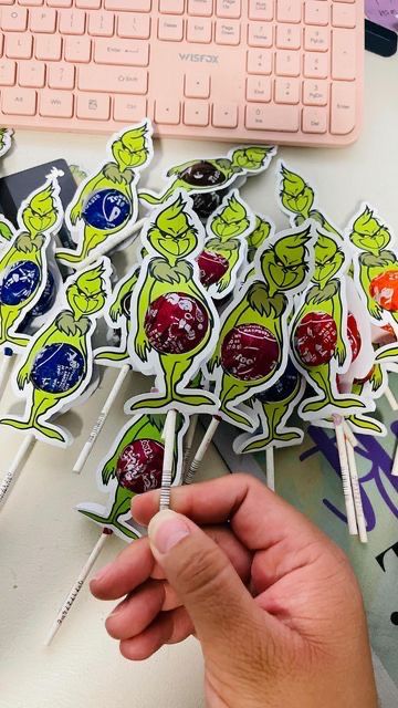 The Grinch Party Favors, Christmas Themed Party Favors, Grinch Class Gifts, Grinch Theme Decorations Diy, Grinch Lollipop Holder, Grinch Christmas Gifts Diy, Mr Grinch Birthday Party, The Grinch 3rd Birthday Party, Grinch School Christmas Party