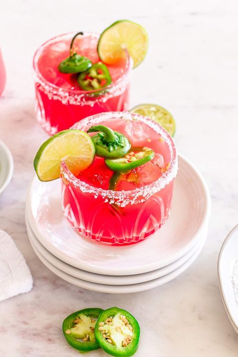 This incredible recipe for watermelon and jalapeno margaritas is so quick and easy to make. It's a lovely drink because of the flavor contrast - you can expect sweetness from the watermelon and agave syrup, a spicy hint from the jalapeno slices, tangy lime juice, and silver tequila and Triple Sec to booze it up! This is a great drink to whip up if you're having a pool party, BBQ or even looking for something unusual to sip in the evening when the weather is balmy and you're in a summery mood. Watermelon Jalapeno Margarita, Pool Party Bbq, Seafood Salad Pasta, Jalapeno Margarita, Watermelon Margarita, Silver Tequila, Classic Margarita, Air Fried Chicken, Fresh Watermelon