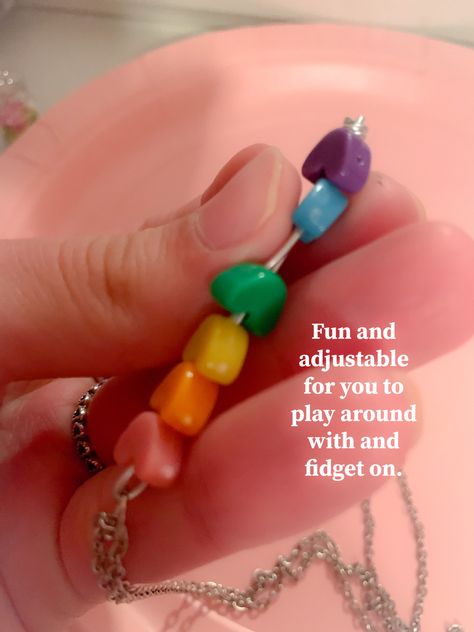 A Necklace you can fidget on! It wont look obvious that ur fidgeting and will look like ur just playing with ur necklace #diyideas #diy #tiktokusa #tiktok #jewelrymaking #smallbusinessowner #handmade #fidget #rainbow #wire Fidget Necklace Diy, Fidget Jewelry Diy, Diy Fidget Jewelry, Diy Fidget Ring, Fidget Crafts, Diy Fidgets, Fidgets Diy, Fidget Jewelry, Wire Board