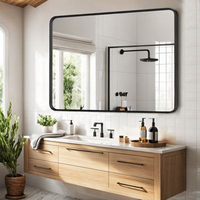 Embrace modern sophistication with our rounded metal frame mirror. Its clean, rounded rectangular shape and subtle details, such as a seamless frame and a floating effect, add a delicate touch to any decor in your bathroom, bedroom, living room, fireplace, or entryway. Available in Matte White or Matte Black, each with a fine granular finish, this mirror offers versatile elegance. Ebern Designs Size: 30" x 40" | Ebern Designs Asua Metal Rectangle Mirror black / grayMetal | 30" x 40" | Wayfair |… Rectangular Mirror Bathroom, Bathroom Mirror Inspiration, Rectangular Vanity Mirror, Rectangle Bathroom Mirror, Bathroom Mirror Wall, Rectangular Bathroom Mirror, Modern Bathroom Mirrors, Mirror For Entryway, Room Fireplace