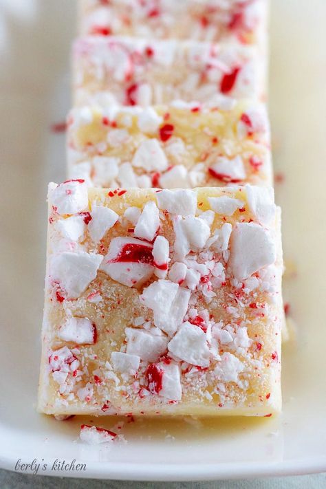 Three square pieces of fudge in a row on a large rectangular serving platter. White Chocolate Peppermint Fudge, Chocolate Peppermint Fudge, Peppermint Fudge Recipe, Christmas Confections, Cake Batter Fudge, Holiday Recipies, Peppermint Crunch, Marshmallow Fudge, Happy Festivus