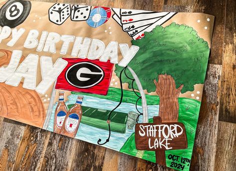 Birthday banner with all their favorite things! Love how this one turned out!❤️🫶🏼🌟 #bdaybanner #banners #georgia #godawgs #fishing #beach #dirtroad #bannersdesign Birthday Banner For Men, Painted Banners, Painted Banner, Paper Banners, Custom Banners, Fish Painting, Man Birthday, Birthday Banner, Banner Design