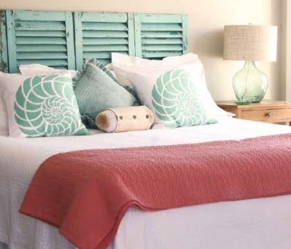 One of the easiest DIY headboard ideas I've come across are shutters. You simply lean them against the wall. No measuring, no drilling holes -things I'm always trying to avoid! And they surely go with the coastal theme.

On a side note: Check out above shell pillows in this setting. Headboard Ideas, Beach Room, Diy Headboards, Coastal Bedrooms, Diy Headboard, Beach Bedroom, Style Deco, Bedroom Themes, Beach House Decor