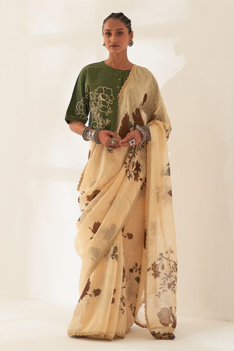 Whole wheat beige pure linen handloom saree with all-over multi colored floral patterns prints. Comes with contrast unstitched blouse piece. Components: 2 Pattern: Printed Type Of Work: Floral Fabric: Pure Linen Color: Beige Other Details:  Scalloped hem saree Tassel edged palla 100 count handcrafted linen base Dimensions: Width: 45 inches Length: 5.5 mtrs Note: The unstitched blouse is same as shown in the image. The stitched blouse and all the jewellery worn by the model is not for sale. Occas Saree Tassel, Draping Styles, Long Blouse Designs, Saree Painting Designs, Saree Draping, Khadi Saree, Unique Blouse Designs, Unique Blouse, Linen Color