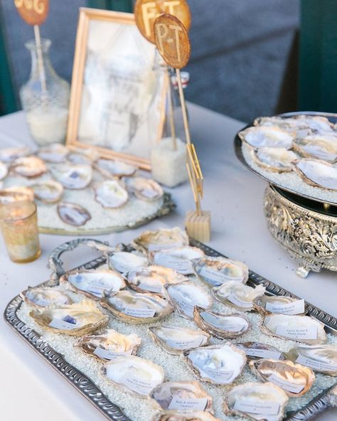 Oyster shells add such a charming, Lowcountry touch to a wedding--McKenna and Matt chose to paint shells in gold and use them as escort cards! Link in profile to see more from their Charleston wedding. By @DanaCubbage, planning by @CruzCoordination, florals by @BranchStudio. Paint Shells, Outdoor Bridal Showers, Painted Shells, Coastal Wedding, Oyster Shells, Southern Weddings, Nautical Wedding, Charleston Wedding, Southern Wedding