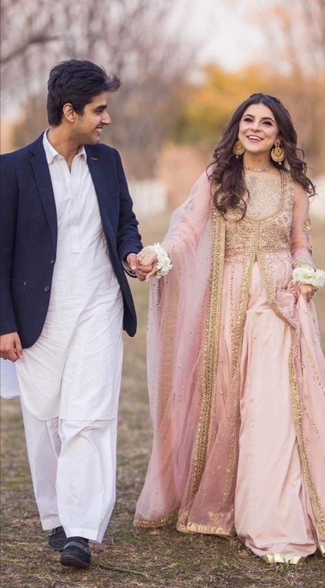 A lovely rustic pink open peshwas with stone and gotta work is elegant look to carry for engagement. This dress is from @mahawajahat. Pink Engagement Dress Pakistani, Engagement Dress Pakistani, White Pakistani Bridal, White Pakistani Bridal Dress, Dresses For Wedding Function, Walima Dresses Pakistani Brides, Nikkah Hair, Pakistani Nikkah, Engagement Hairstyle