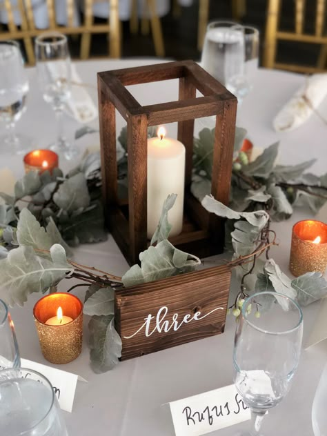 Greenery And Wood Centerpiece, Wooden Box Centerpiece Wedding, Gold Candle Holder Centerpieces Rustic, Wood Candle Centerpiece, Wood Box Centerpiece Wedding Candle, Wooden Lantern Centerpiece Wedding, Wood Table Numbers Wedding, Lantern Decor Wedding, Wood Table Numbers