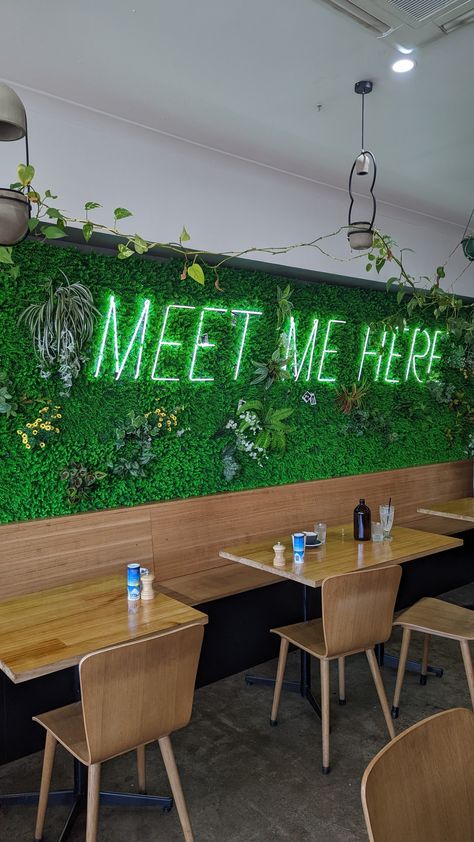 Cute neon green sign in a Melbourne cafe Neon Cafe Interior Design, Green Wall With Led Sign, Green Leaf Wall With Neon Sign, Neon Coffee Shop, Neon Signs For Coffee Shop, Neon Signs Cafe Coffee Shop, Juice Bar Interior, Restaurant Exterior Design, Greens Restaurant