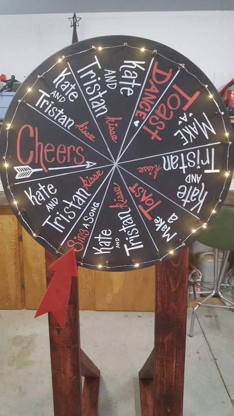 Our wedding wheel for the kissing game. Wedding Wheel Game, Kitsch Wedding, Kissing Games, Non Traditional Wedding Ring, Festival Themed Wedding, Wedding Kiss, Gaming Decor, Wedding Games, Diy Dog