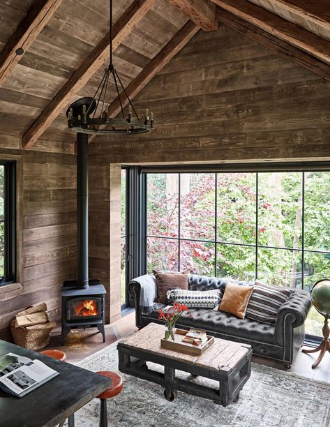 wood-paneled-room-wood-burning-stove-3f06ed46 Small Log Cabin Interior, Cabin Interior Design Ideas, Log Cabin Interior Design, Coastal Decorating Ideas, Extension Veranda, Barndominium Interior, Cabin Interior Design, Log Cabin Interior, Small Log Cabin