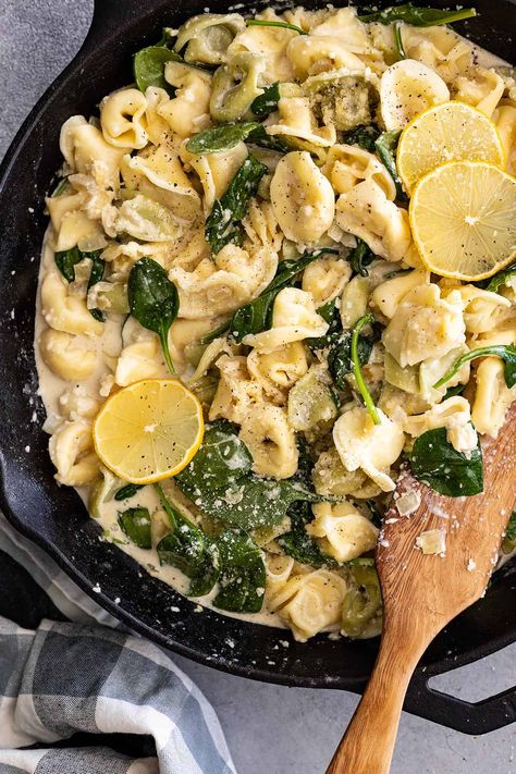 Overhead view of creamy lemon tortellini in a skillet with wood spatula to the side. Creamy Cheesy Tortellini, Creamy Lemon Tortellini, Creamy Broccoli Tortellini, Lemon Tortellini, Lemon Parmesan Sauce, Creamy Tuscan Tortellini, Wood Spatula, Recipes Using Ground Beef, Tortellini Recipes