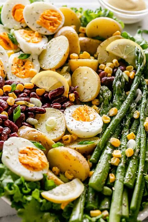 Healthy, fresh, and delicious Spring Salad prepared with asparagus, potatoes, hard boiled eggs, and beans. A tangy and sweet homemade Lemon Dijon Vinaigrette brings everything together. #springsalad #hardboiledeggs #asparagus #healthyrecipes #saladrecipes Lemon Dijon Vinaigrette, Potato Salad Healthy, Weekly Menu Plan, Clean Eating Salads, Dijon Vinaigrette, Panzanella Salad, Green Bean Salads, Asparagus Salad, Salad Healthy