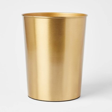 Keep clutter under control while adding a decorative accent to your space with this Antique Wastebasket from Threshold™. This metal wastebasket features a cylindrical silhouette with an open-top design for easy disposal of trash, while the compact size makes it ideal for any room or corner, as well as easy to slide under desks. Showcasing a glossy brass finish, this washroom wastebasket brings rustic-inspired charm to your living space. Gold Garbage Can, Pink And Gold Bathroom Accessories, Powder Room Waste Basket, Cute Trash Can Bedroom, Office With Gold Accents, Brewery Bathroom, Powder Room Accessories, Mexico Bedroom, Gold Trash Can