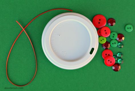 Upcycle your coffee cup lid into a festive Christmas ornament Plastic Coffee Lids Crafts Ideas, Plastic Coffee Cup Lids Crafts Ideas, Crafts With Coffee Cup Lids, Coffee Lid Crafts, Morning Centers, Lid Crafts, Plastic Coffee Cup, Plastic Coffee Cups, Holiday Kids