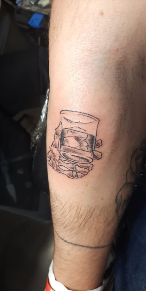 Skeleton hand holding whiskey glass tattoo Whiskey Glass Tattoo, Whisky Glass Tattoo, Skeleton Drinking Tattoo, Skeleton Drinking Beer Tattoo, American Traditional Whiskey Glass Tattoo, Skull In Whiskey Glass Tattoo, Wine Glass Tattoo, Skeleton Hands, Piercing Tattoo