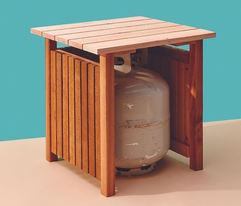 Keep your propane tank out of sight with this handy table - Cottage Life Package Drop Box Ideas, Duplex Backyard, Propane Tank Cover, Propane Fire Pit, Cottage Life, Front Yard Landscaping Simple, Diy Fire Pit, Diy Cans, Bottle Storage