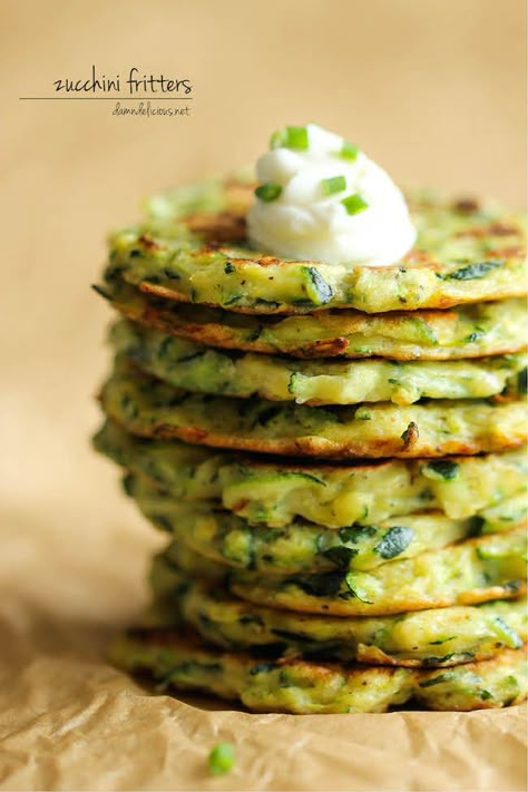 Zucchini Fritters - These fritters are unbelievably easy to make, low calorie, and the perfect way to sneak in some veggies! Zucchini Puffer, Wheat Belly, Zucchini Fritters, Yum Recipes, Zucchini Recipes, Spaghetti Squash, Veggie Dishes, Beignets, Easy Delicious