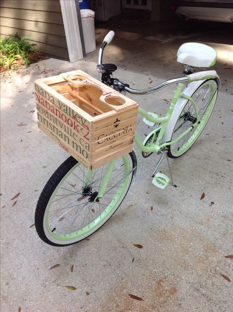 Bike basket I made for my wife's new bike. Made from two wooden wine crates. My wife saw one on a bike in Charleston and wanted one. Adapted the mounting bracket from the old wire basket that she did have. Even comes with drink holders. Diy Bike Basket, Bike Accessories Diy, Wooden Wine Crates, Bike Diy, Wine Crates, Beach Cruisers, Biking Diy, Coffee Bike, Coffee Holder