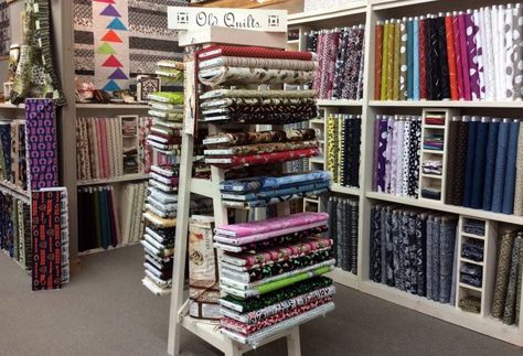 Countryside Village Gifts and Quilt Fabric Shop -- Neat display. Fabric Shop Display Ideas, Warehouse Gallery, Fabric Shelves, Fabric Shop Display, Quilt Shop Displays, Fabric Store Displays, Fabric Store Design, Countryside Village, Warehouse Design