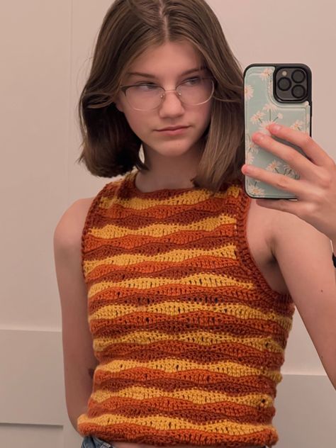 orange and yellow wave stitch crochet tank top Wave Stitch Crochet Top, Orange Top Crochet, Crochet 80s Clothes, Orange Crochet Projects, Crochet Orange Top, Crochet Wave Top, Orange Crochet Ideas, Wave Crochet Pattern, Yellow Crochet Projects