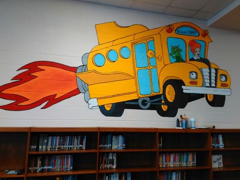 Library mural of The Magic School Bus painted in public school library School Bus Wall Mural, Magic School Bus Decorations, Magic School Bus Bulletin Board, Magic School Bus Classroom Theme, Magic School Bus Classroom, Bus Mural, Library Mural, Classroom 2023, The Magic School Bus