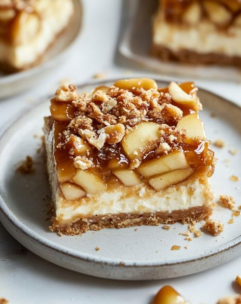 These Salted Caramel Apple Cheesecake Bars are a delightful fusion of autumn flavors and rich textures. No Bake Caramel Apple Cheesecake Bars, Carmel Apple Cheesecake Bars, Apple Cheesecake Bars, Caramel Apple Cheesecake Bars, Salted Caramel Cheesecake, Caramel Apple Cheesecake, Apple Cheesecake, Buttery Shortbread, Shortbread Crust