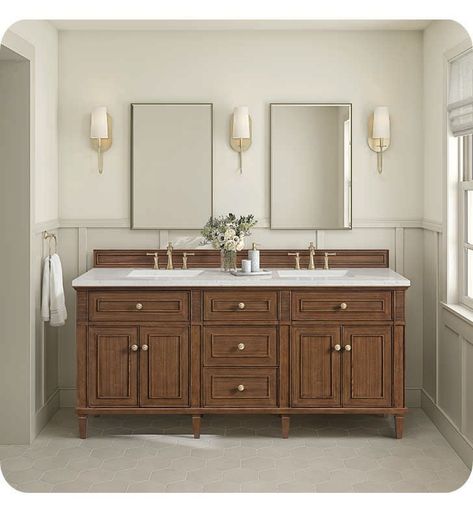 The 71 7/8" Lorelai Double Vanity celebrates timeless form and exquisite finish details, combined with practical function. The beauty of the natural grains in the walnut veneer is accented by reeded details, and clean, raised picture frame molding. The decorative, coin-edge knobs in Champagne Brass provide the perfect complement to the Mid-Century Walnut finish. This four-door cabinet opens to spacious interior with shelves and convenient USB/Electric power outlets. Three traditional drawers and Colonial Home Bathroom, Cherry Cabinet Bathroom Ideas, Wood Wainscoting Bathroom, American Classic Bathroom, Bathroom Vanity Styling, Vanity Styling, Bathroom Double Vanity, Wood Double Vanity, Vintage Modern Bathroom