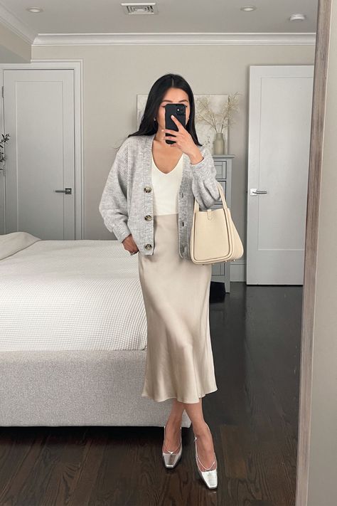 Quince slip skirt, quince cardigan, songmont bag, J Crew heels Quince Cardigan, Songmont Bag, Slip Skirt Outfits, Knitted Skirt Outfit, Cardigan And Skirt Outfit, Satin Skirt Outfit Summer, Satin Slip Dress Outfit, Modest Feminine Outfits, Corporate Fits