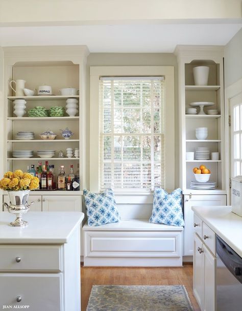 Idea for window seats under kitchen windows with bookshelves on either side and storage in seat. Kitchen Couch Seating Window, Pantry Around Window, Kitchen Design With Low Windows, Kitchen Oven Between Windows, Low Window In Kitchen Solution, Window Seat Between Bookcases, Shelves On Either Side Of Window, Kitchen Storage Under Window, Under Window Kitchen Storage