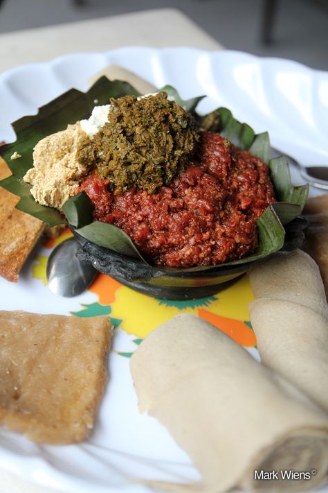 Kitfo in Ethiopia Ethiopian Kitfo, Ethiopia Recipes, Eritrean Food, Ethiopian Dishes, African Food Recipes, Ethiopian Recipes, Raw Beef, Ethiopian Cuisine, Veal Recipes