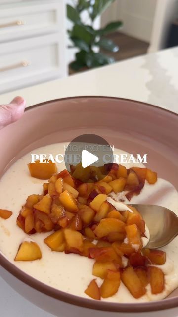 Rachel Dodge on Instagram: "This peaches & cream bowl is a delicious, high protein snack or dessert made with fresh, ripe summer peaches and yes… cottage cheese!   Here’s how to make it:  Blend one serving of cottage cheese (I use @good_culture) in a blender with 1 tablespoon of honey, 1/2 teaspoon vanilla bean paste, 1/2 teaspoon lemon juice, & a pinch of salt; until smooth.   Add fresh diced peaches, to a pan with coconut oil. Add a dash of cinnamon. Cook until peaches are soft and caramelized; about 5 mins. *you can add granola, pistachios, almonds, etc.   So simple & so good!! Let me know if you try it! 🍑  #summerpeaches #peachesandcream #highprotein #healthysnacks #cottagecheese" Cottage Cheese Peaches, Cottage Cheese And Peaches, Peach Healthy, High Protein Snack, Vanilla Bean Paste, Cottage Cheese Recipes, Protein Snack, Peaches Cream, Peaches N Cream