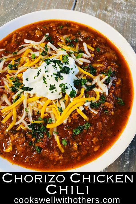 chili in a bowl with cheese and sour cream Chorizo Chilli Recipe, Chorizo Chili Recipe Crock Pot, Ground Chicken Chilli Recipes, Chili With Chorizo, Southwest Chicken Chili Recipe, Red Chili Chicken, Flavorful Chili Recipe, Chorizo Chili Recipe, Sausage Chili Recipe