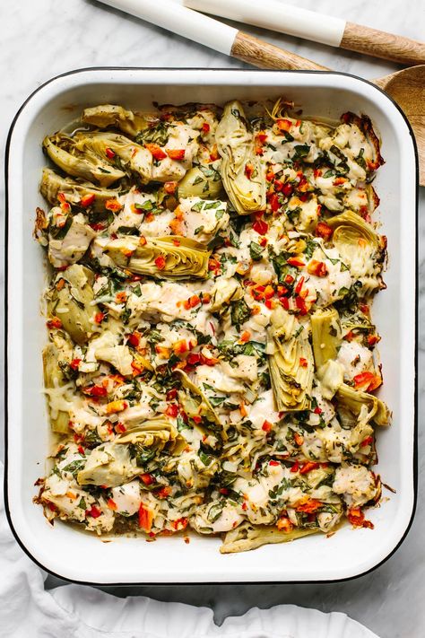 This spinach artichoke chicken bake is savory, cozy, and layered with loads of chicken and veggies for the perfect all-in-one meal prep dish. Chicken Pesto Artichoke Bake, Chicken Thigh And Artichoke Recipes, Chicken Artichoke Sundried Tomato Recipe, Chicken Artichoke Recipes Crock Pot, Mushroom Artichoke Chicken, Crockpot Artichoke Chicken, Chicken Artichoke Mushroom Recipes, Chicken And Artichoke Recipes Healthy, Jared Artichoke Recipes