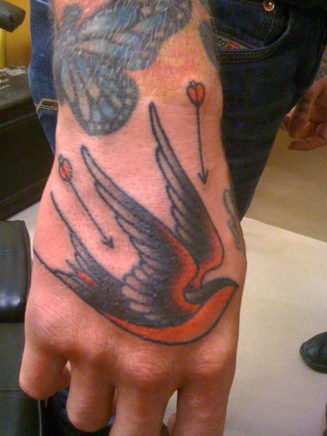 Bird tattoo by Ron Wells. #handtattoo #tattoo #hand American Traditional Hand Tattoos, Traditional Hand Tattoos, American Traditional Hand, Laughing Hyena, Herren Hand Tattoos, Traditional Hand Tattoo, Hand Tattoo Designs, Tattoo Hand, Cowgirl Art