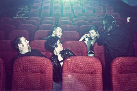 Group portrait captured in an empty movie theater. Movie Theater Reference, Band Portraits, Band Photoshoot, Photo Mood, Group Portrait, Yellow Wall, Band Pictures, Yellow Walls, Band Photos