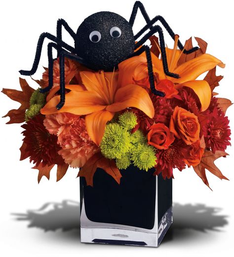 A big black spider creeps your way to wish you a Happy Halloween! This fun Halloween floral decoration presents lush orange and green flowers in a spirited black glass vase. It's a spooky sweet selection when you want to send a Halloween arrangement to a favorite child or fun-loving friend. Halloween Flower Arrangements, Halloween Floral Arrangements, Halloween Floral, Sweet Bouquet, Halloween Centerpiece, Fall Floral Arrangements, Halloween Flowers, Adornos Halloween, Halloween Table