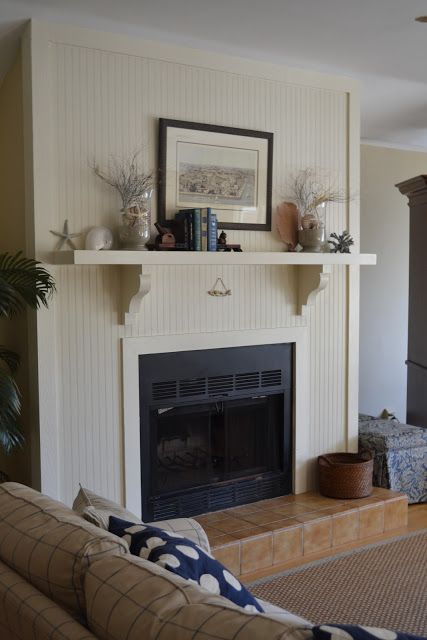 Three Pixie Lane: A Bungalow by the Sea Beadboard Tv Wall, Beadboard Fireplace Wall, Bead Board Fireplace, Beadboard Fireplace, Mantlepiece Shelf, Shelf Corbels, Bungalow Fireplace, Cream Fireplace, Beadboard Walls