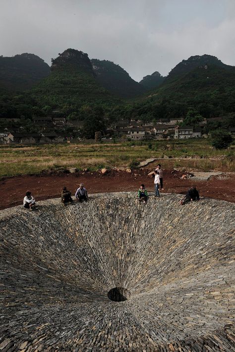 V studio crafts stone sinkhole to symbolize vanishing rain cycle Rain Cycle, Temporary Architecture, Landscaping Supplies, Architectural Sketch, Floor Drains, Landscape Materials, Art Prompts, Natural Phenomena, Land Art