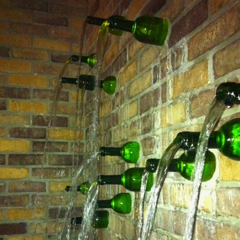 Wine bottle fountain. If only it was wine flowing out of those bottles... Bottle Fountain, Wine Yard, Glass Bottle Wall, Wine Bottle Fountain, Wine Bottle Garden, Wine Bottle Wall, Bottle House, Bottle Trees, Wine Bottle Design