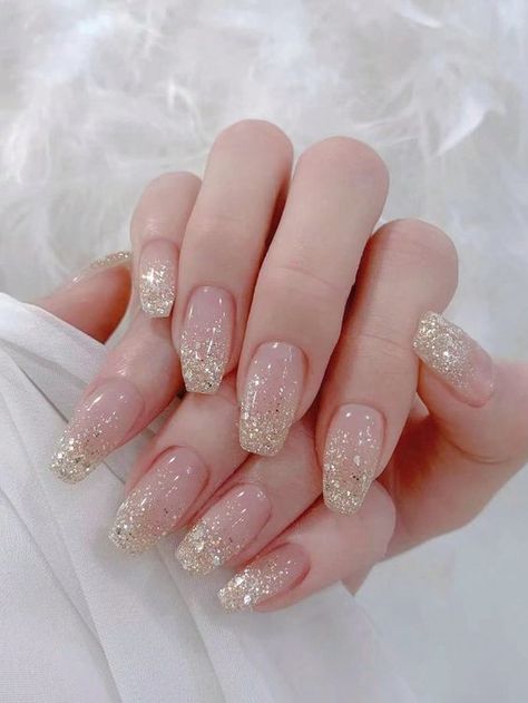 Choose from a vareity of wedding nail ideas to add touch of beauty and elevate your bridal look! Clear Nails With Gold Glitter, Elegant Champagne Nails, Short Round Wedding Nails, Nails Acrylic For Wedding, Champaign Nails, Nails For Wedding Bridesmaid, Sparkly Wedding Nails, Nude And Rose Gold Nails, Pink And Gold Nails