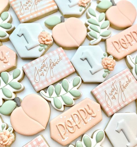 LINDSAY TWIST on Instagram: “Sweet as a peach 🍑  . . . #birthdaycookies #peachcookies #leafcookies #ginghamcookies #sweetasapeach #babyshowercookies #cookiesofinstagram…” Sweet As A Peach First Birthday Cake, One Sweet Peach Cookies, Baking Corner, Peach Cookies, Peach Birthday, Sweet As A Peach, Flooding Cookies, Peach Baby Shower, Cookies Theme