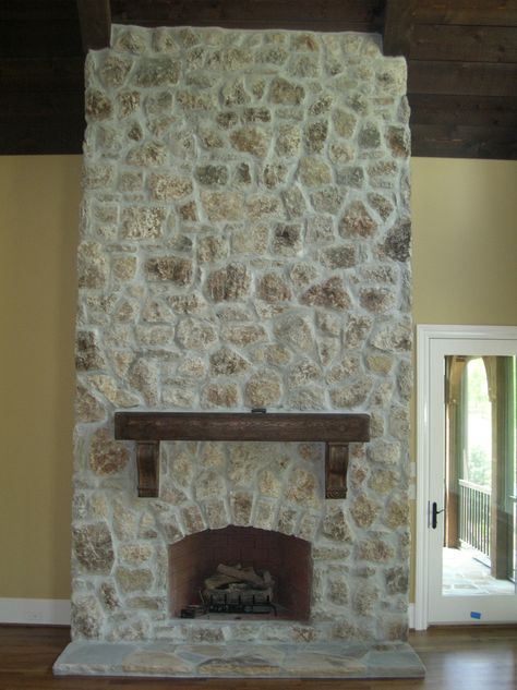 This is a great application of a stone that came from Oregon (I think), we used a dense overgrout and wipe over so that a smaller amount of the stone would show through. It's a very rustic stone. Fireplace Smear, Overgrout Fireplace, Moss Rock Fireplace, Tuscan Stone Wall, Painted Rock Fireplaces, Painted Stone Fireplace, White Wash Fireplace, Lime Wash Walls, Stone Fireplace Makeover