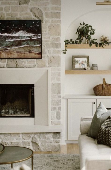 Limestone Fireplace With Built Ins, Modern European Fireplace Ideas, Transitional Fireplace Surround Ideas, Tall Fireplace Stone, Stucco And Stone Fireplace, Light Fireplace Stone, Transitional Home Fireplace, White Stone Fireplace With Built Ins, Natural Fireplace Ideas