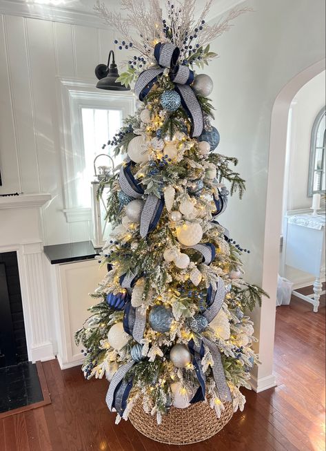 My Christmas Tree is now on sale !! Flocked Christmas tree. King of Christmas Queen Slim Flocked Blue ribbon, blue ornaments Follow my shop @beach_life_living on the @shop.LTK app to shop this post and get my exclusive app-only content! #liketkit #LTKSeasonal #LTKHoliday #LTKhome @shop.ltk https://liketk.it/3WLKs Decorated Flocked Tree Ideas, Flocked Coastal Christmas Tree, Blue And Cream Christmas Tree, Navy And Blush Christmas Tree, Blue Champagne Christmas Tree, Blue Themed Christmas Tree Ideas, Christmas Tree Slim Decorating Ideas, Flocked Christmas Tree Blue, Flocked Christmas Trees Decorated Blue